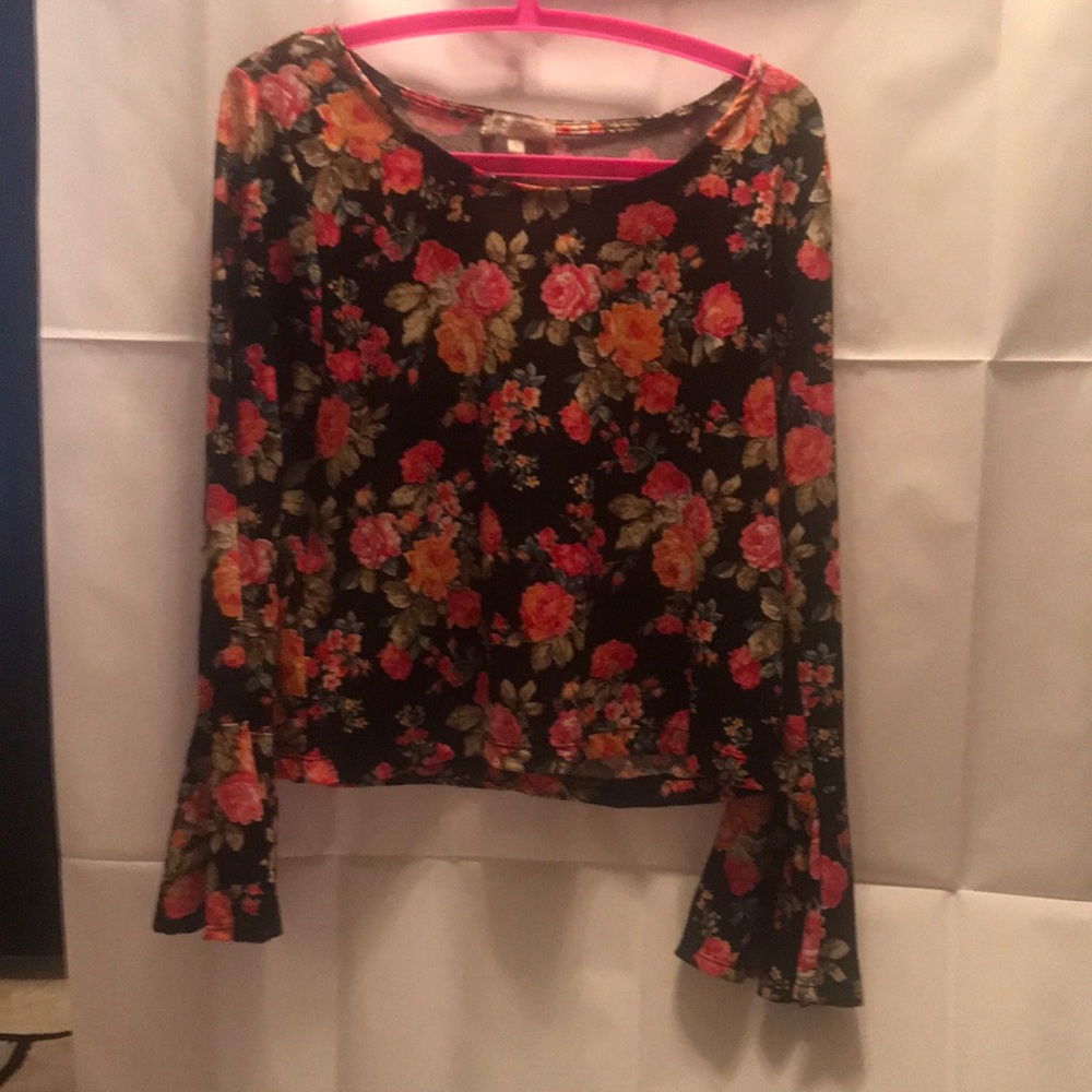 Step out of winter into spring with a Vintage blouse that has a flower print